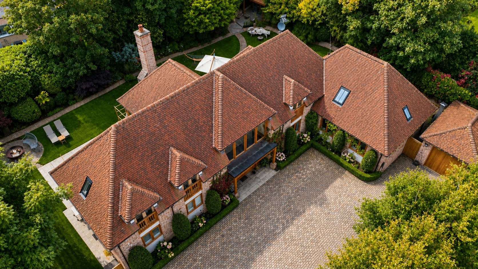 Residential roof after professional cleaning — restored terracotta tiles