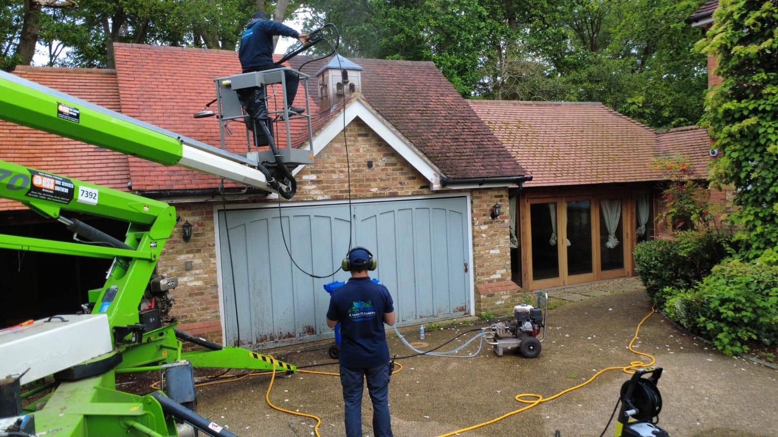 QNEXAPLUS technician and full access equipment on site during final roof inspection and quality assurance